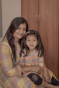 Portrait of happy mother with daughter