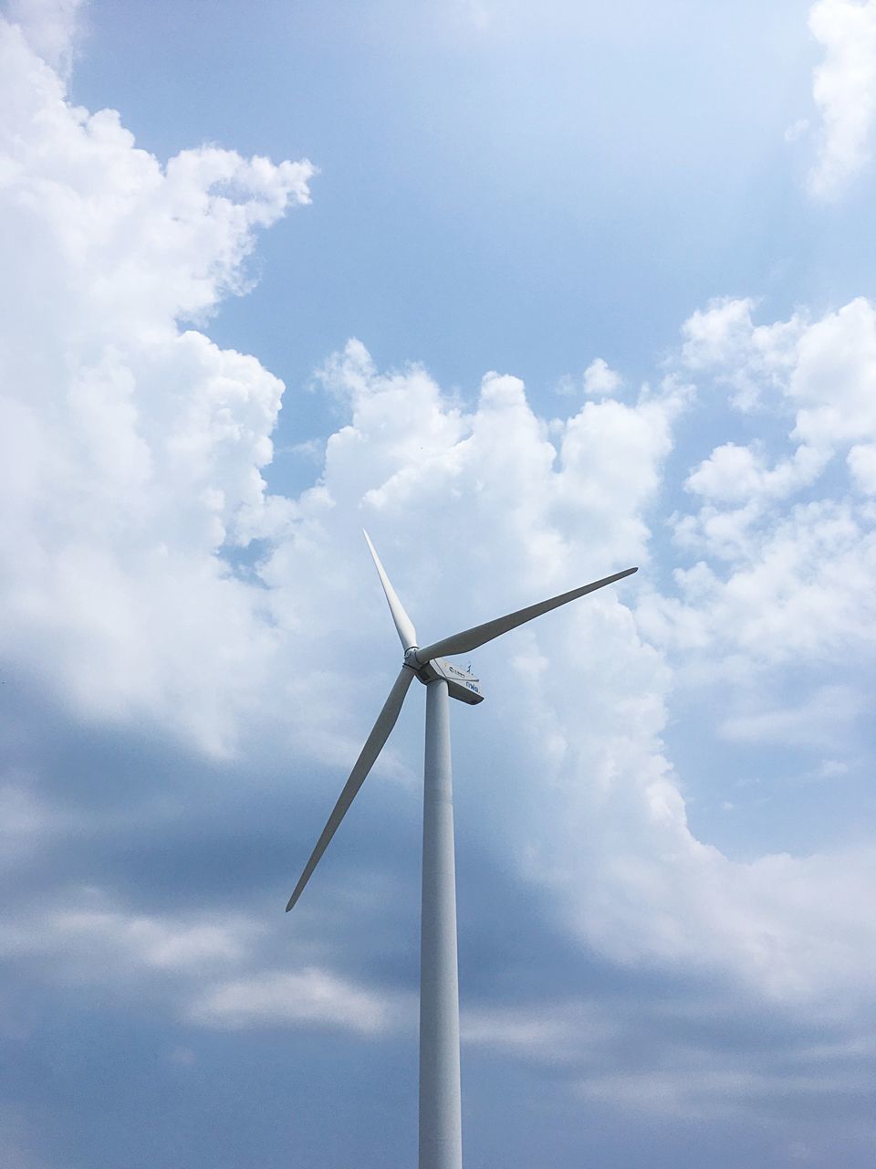 cloud - sky, wind turbine, environmental conservation, turbine, renewable energy, sky, wind power, alternative energy, low angle view, fuel and power generation, environment, day, nature, no people, technology, outdoors, sustainable resources, sunlight, tall - high, white color