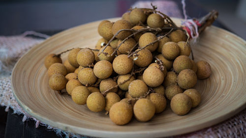 Close-up of fruits in container on table