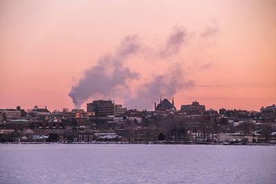 Panoramic view of city against sky during winter