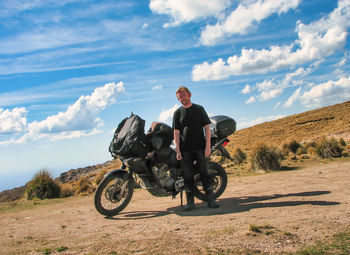 Man riding motorcycle on road