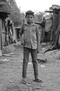 Portrait of boy standing outdoors