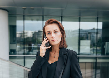 Portrait of young woman looking away