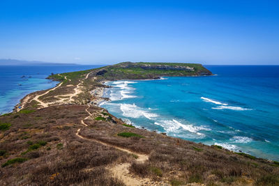 Scenic view of sea against clear blue sky