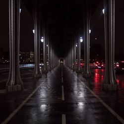 Illuminated corridor of building at night