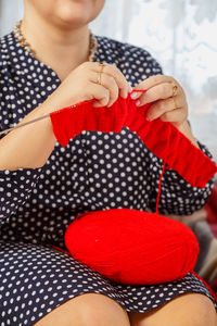 Midsection of woman holding gift