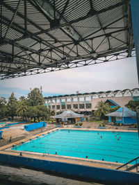 View of swimming pool against buildings