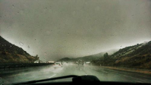 Road seen through car windshield