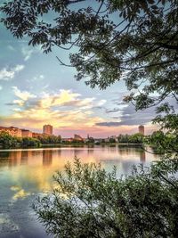 Scenic view of river against cloudy sky
