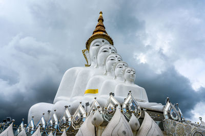 Low angle view of statue against building