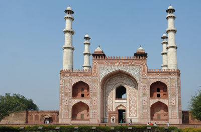 Facade of historic building against clear sky