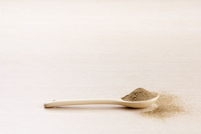 High angle view of bread on table against white background