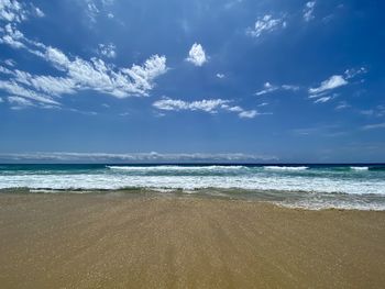 Scenic view of beach against sky