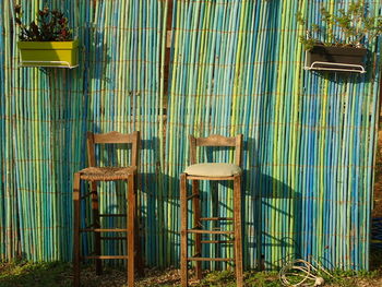 Empty chairs and tables in cage