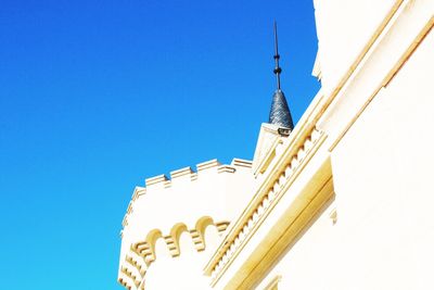 Low angle view of building against clear blue sky