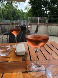 Close-up of wine glasses on table in restaurant