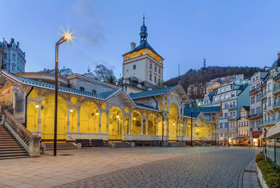 View of illuminated buildings against sky at dusk