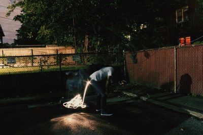 Full length of woman standing at night