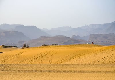 Scenic view of desert against clear sky