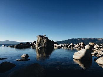 Scenic view of sea against clear blue sky