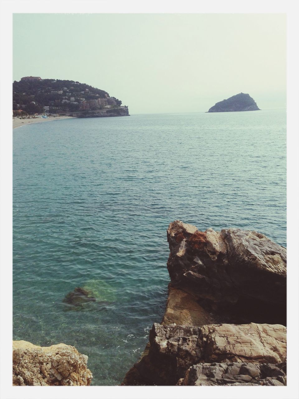 sea, water, horizon over water, transfer print, scenics, tranquil scene, tranquility, beauty in nature, rock - object, clear sky, rock formation, auto post production filter, nature, rock, idyllic, sky, cliff, beach, shore, seascape