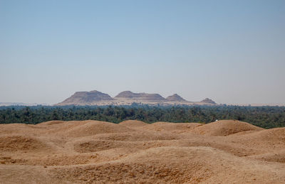 Scenic view of desert against clear sky