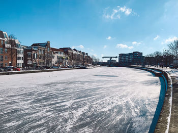 Panoramic view of sea and buildings against sky