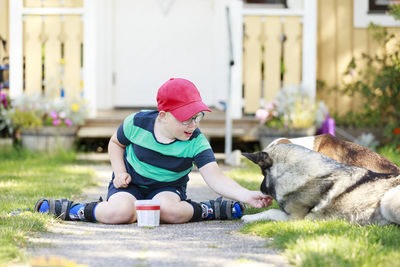 Boy with dogs in garden