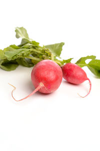 Close-up of strawberries on table against white background