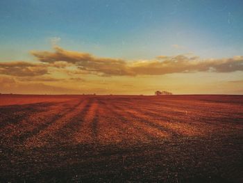 Scenic view of landscape at sunset