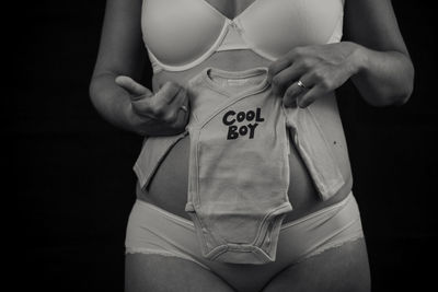 Midsection of woman with text