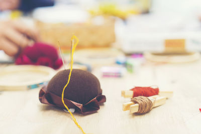 Close-up of pin cushion on table