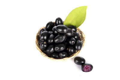 High angle view of berries on white background