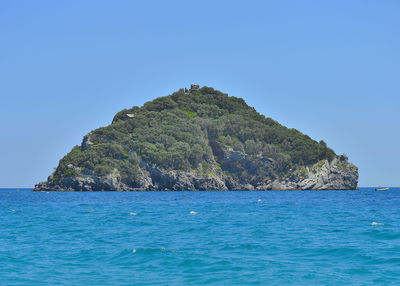 Scenic view of sea against clear blue sky