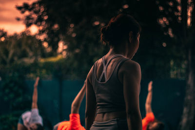 Rear view of woman standing outdoors