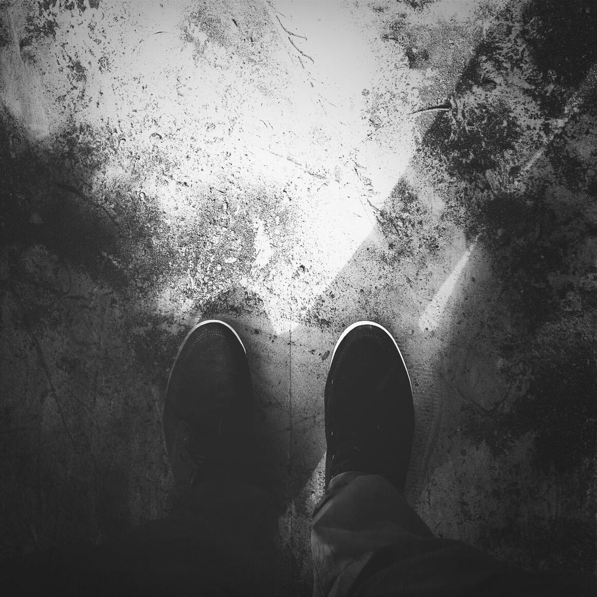 low section, person, personal perspective, shoe, standing, lifestyles, human foot, footwear, leisure activity, high angle view, unrecognizable person, men, jeans, part of, street, directly above, day