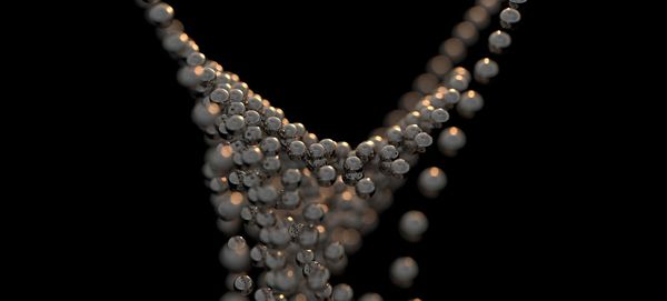 Close-up of necklace on black background