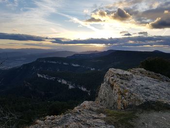 Scenic view of mountains against sky during sunset