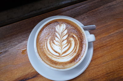 High angle view of cappuccino on table