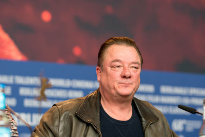 Close-up portrait of smiling mid adult man