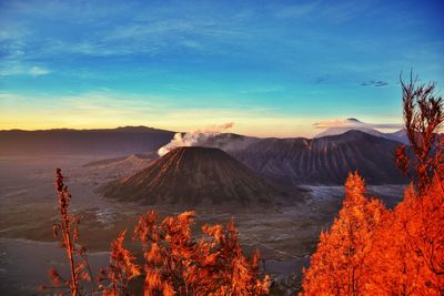 Scenic view of volcano mountains against sky during sunset
