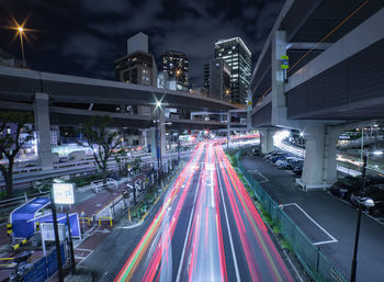 High angle view of light trails on road at night