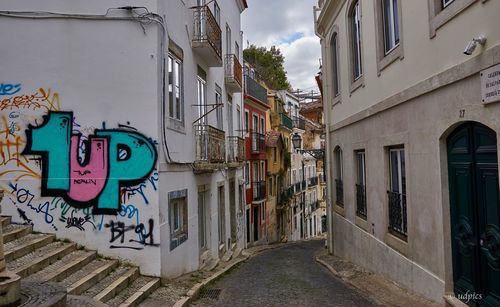 Graffiti on wall against sky