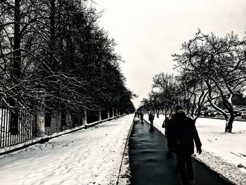 People walking on road in winter