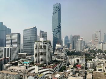 Modern buildings in city against sky