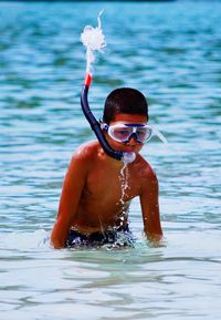 Boy swimming in water