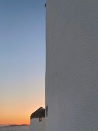 Low angle view of building against sky during sunset