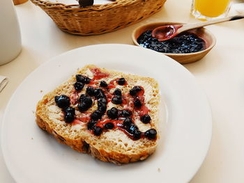 Close-up of breakfast served in plate on table