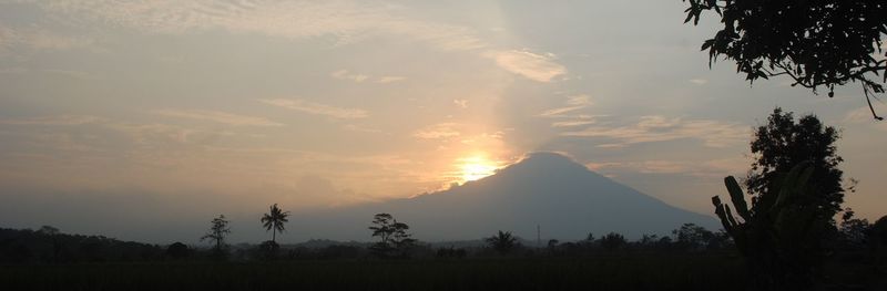 Scenic view of silhouette landscape against sky during sunset