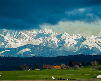 Scenic view of snowcapped mountains against sky